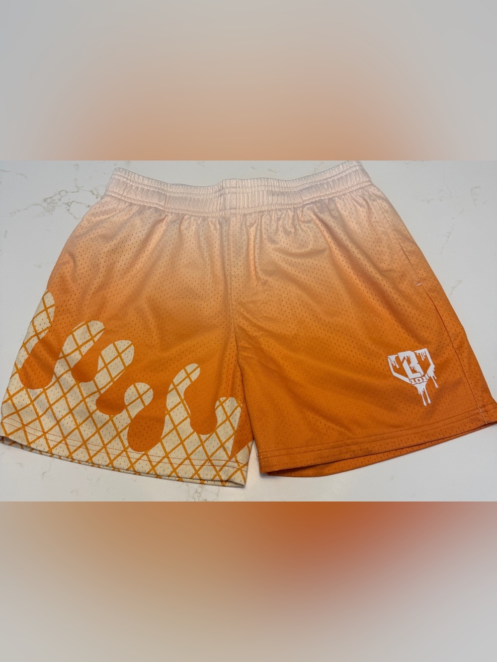 Kids Orange Athletic Mesh Shorts with Graphic Print